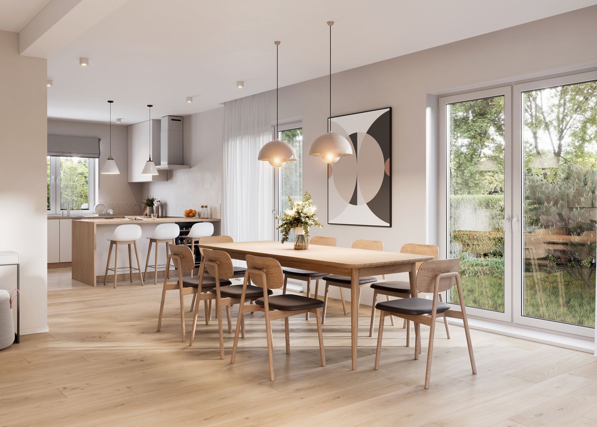 A dining room with a long table and chairs and a kitchen in the background.