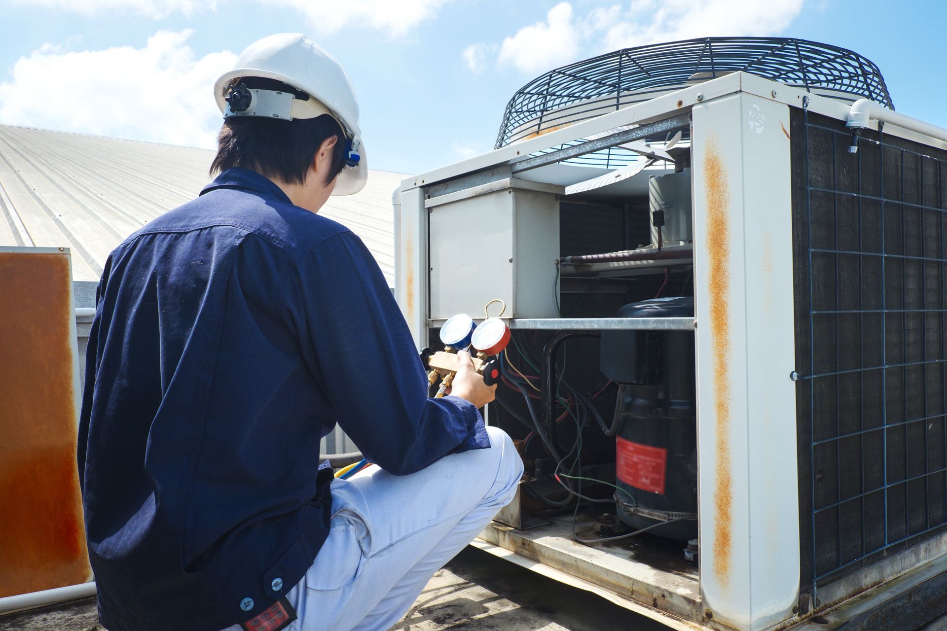 Technician Is Checking Air Conditioner