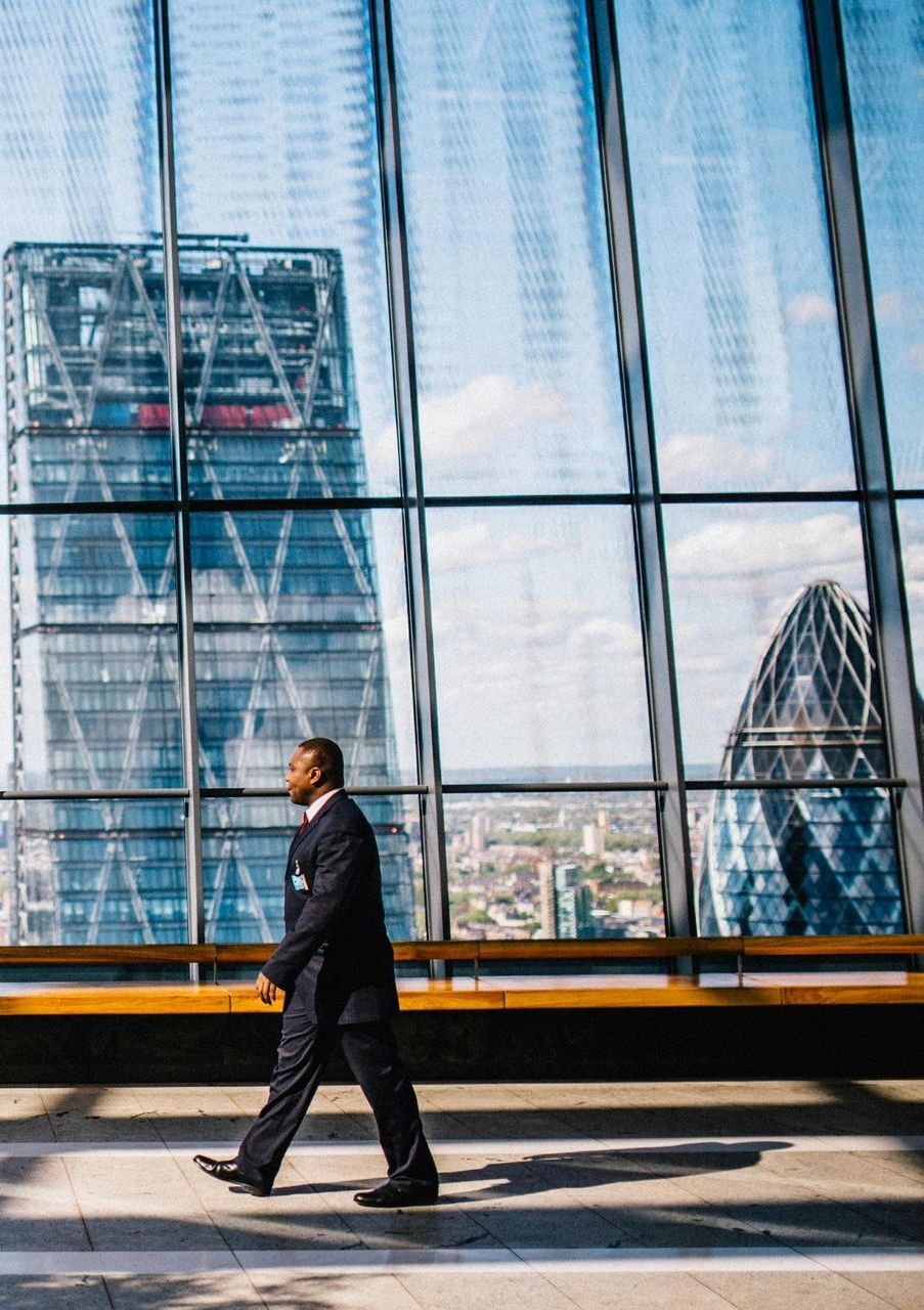 Man walking inside skyscraper