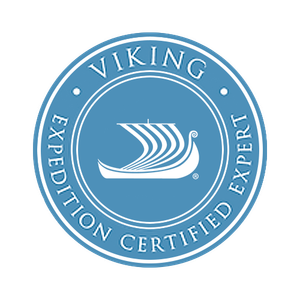 A blue viking expedition certified logo with a boat in the center