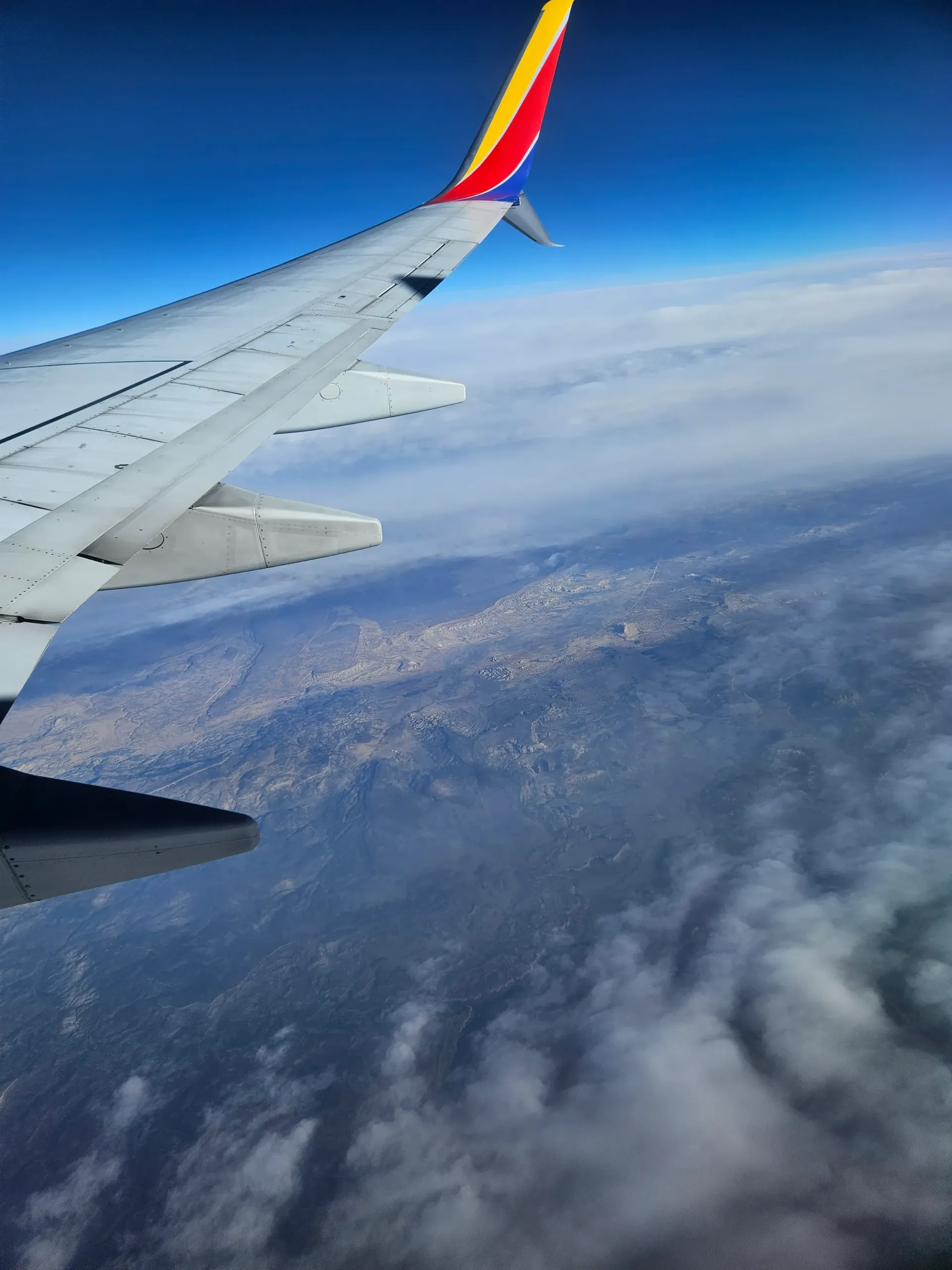 A southwest airlines plane is flying through the clouds