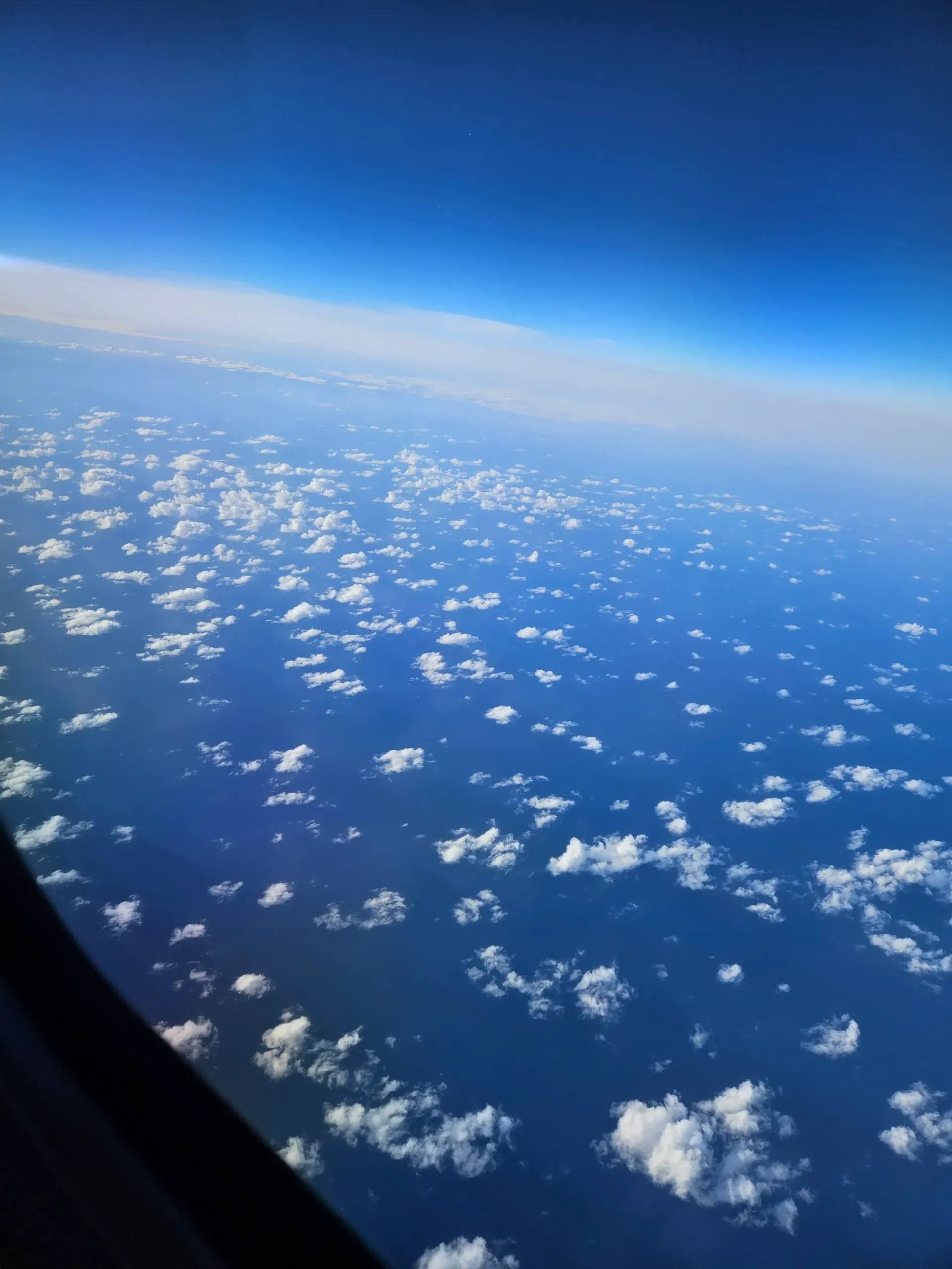 A view of the clouds from an airplane window