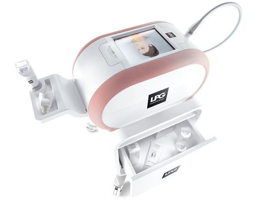 Dispositivo portatile LG bianco e rosa con schermo, collegato a una base e a una docking station per la ricarica.