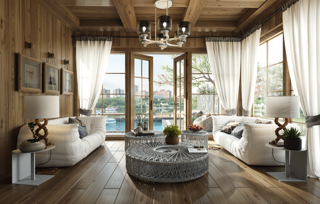 Cozy rustic living room with white sofas, wood beams, large windows, and a lake view galveston texas