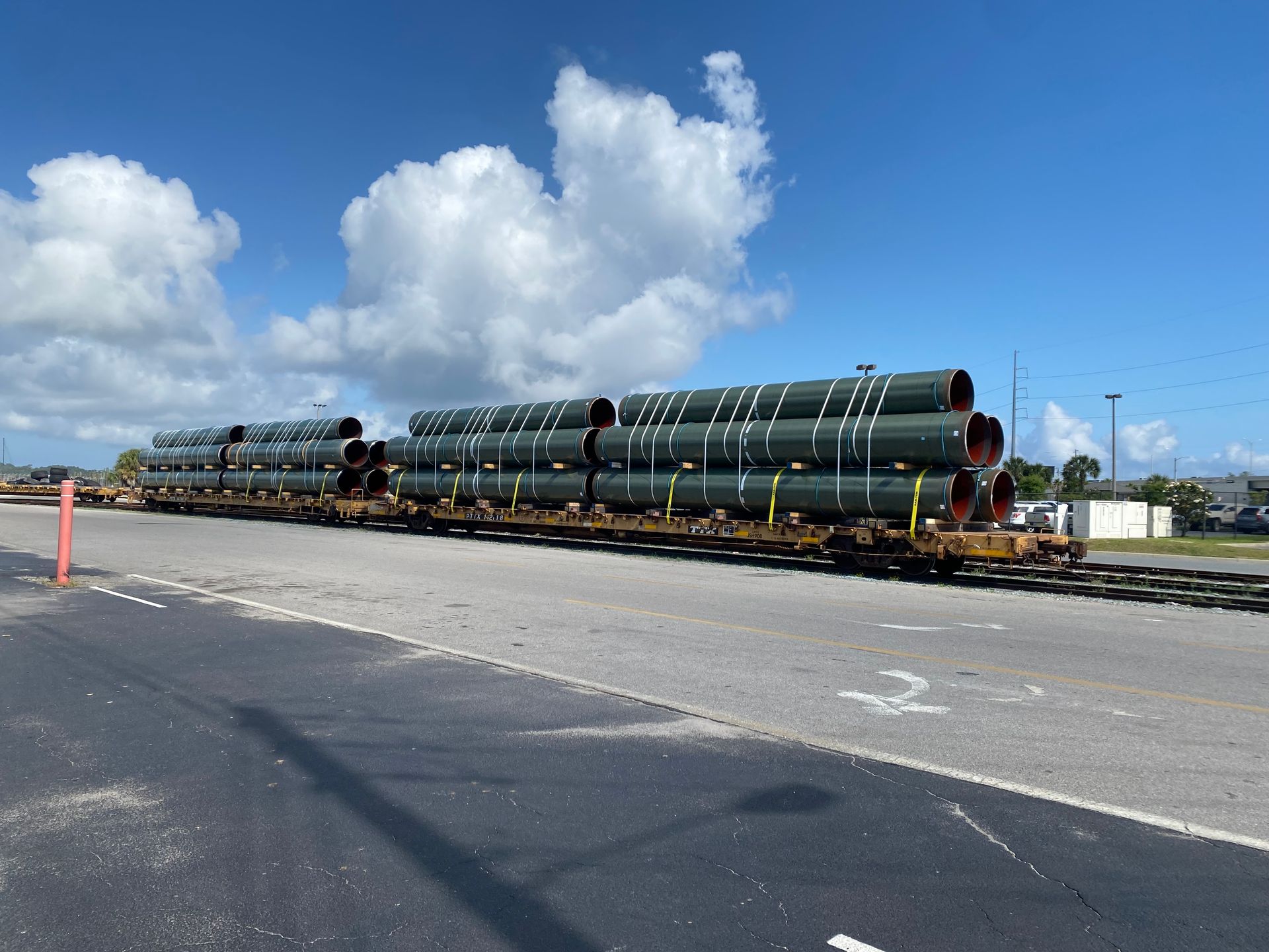 A train with a lot of pipes on it