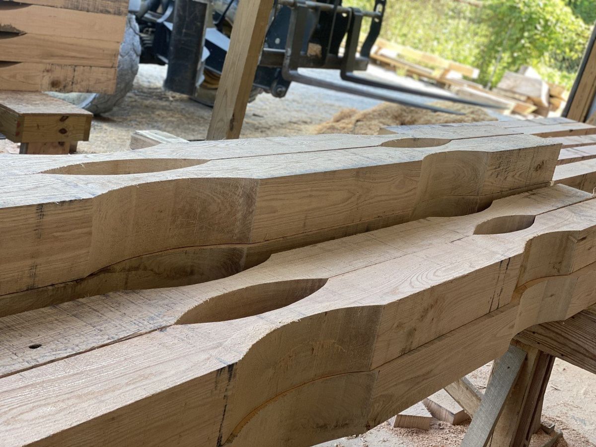 A close up of a piece of wood with holes in it