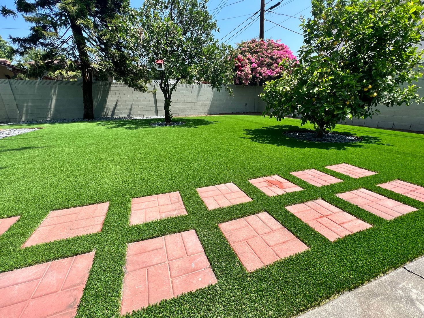 red stepping stones and fake turf