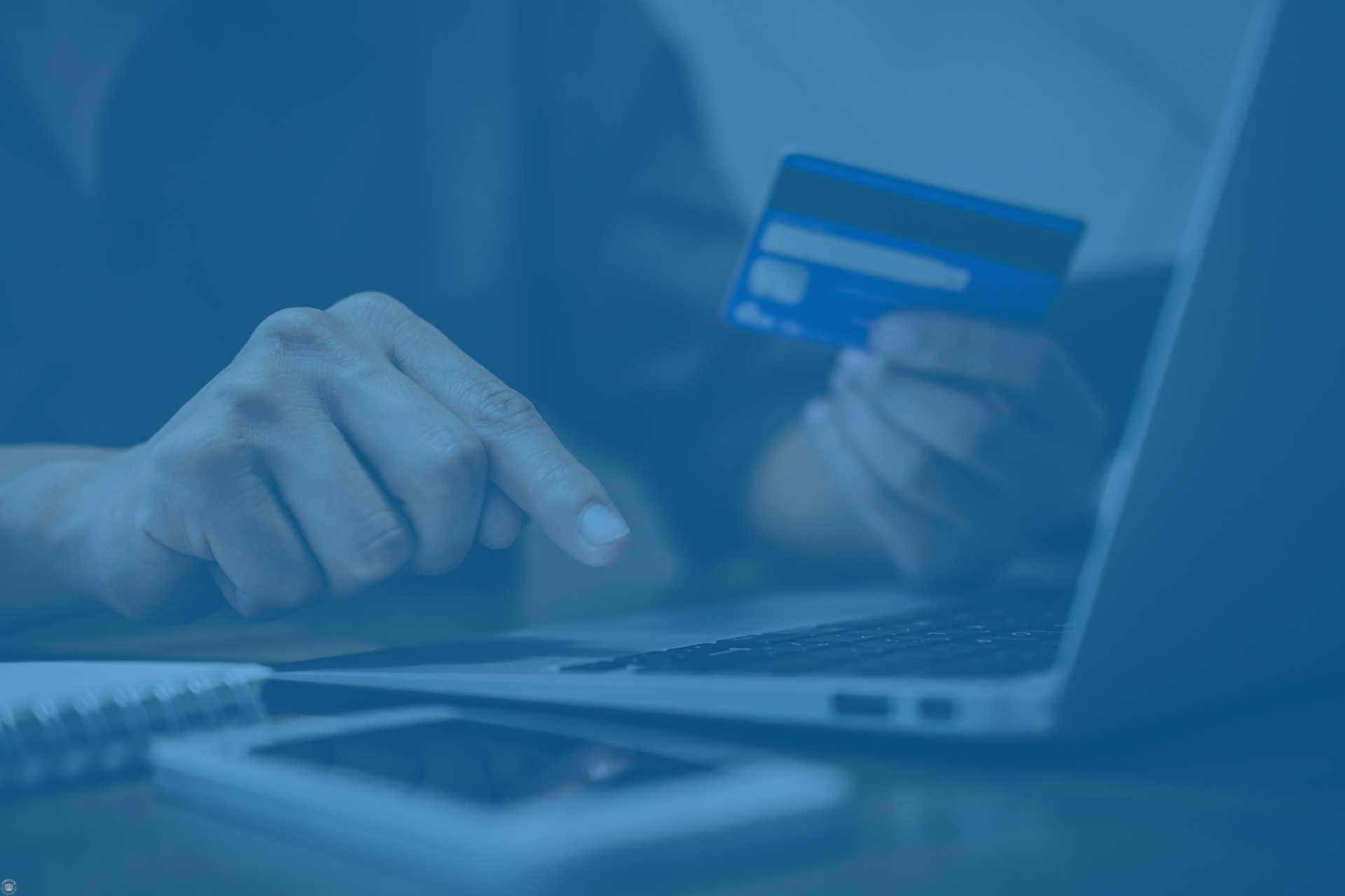 Using a laptop and credit card, representing commission payment tracking and dispute resolution.