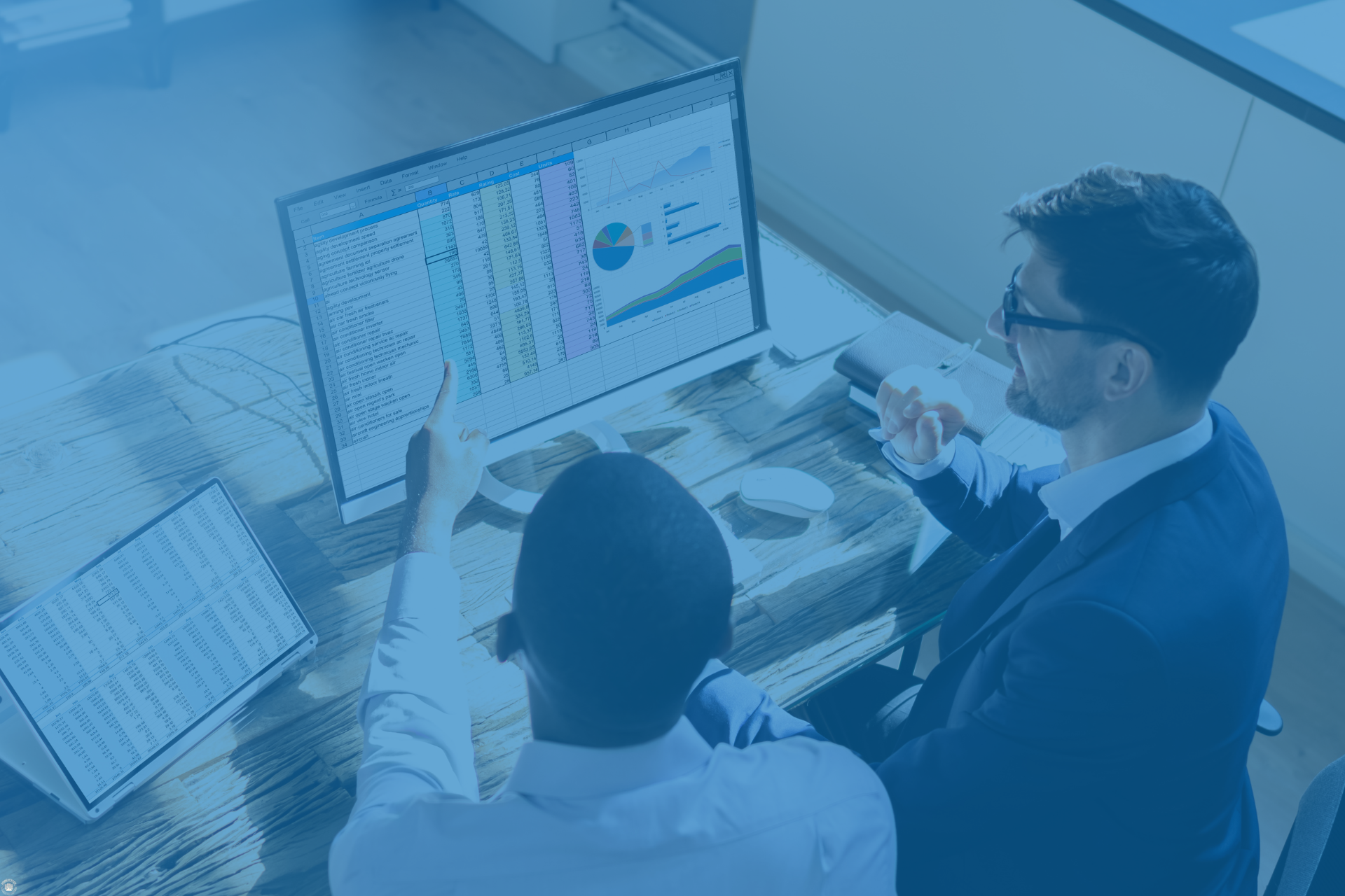 Reviewing financial data and charts, representing commission tracking and residual payments.