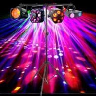 Colorful stage lights casting pink, purple, and blue beams across a dark dance floor
