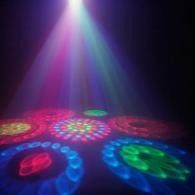 Colorful disco lights and spotlights shining across a dark floor