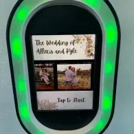 Wedding photo booth screen with green lights and “Tap to Start” prompt