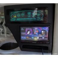 Two stacked car infotainment screens showing colorful menu icons and a purple media player interface