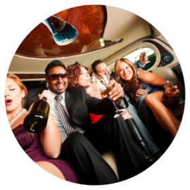 People in formalwear celebrating inside a limousine, holding champagne and smiling