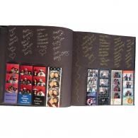 Open scrapbook with handwritten notes and photo collages on black pages