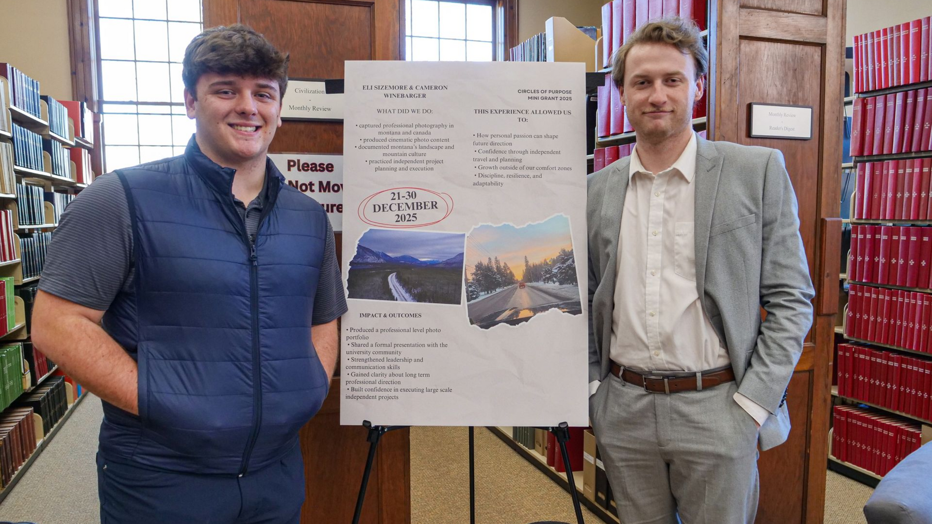 Eli Sizemore and Cameron Winebarger standing with their poster on traveling to Montana.