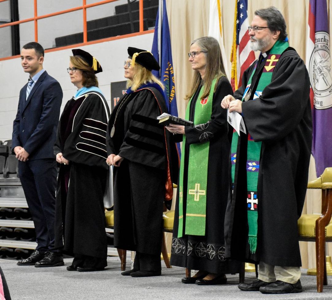 Carlos Sainz Barroso, Dr. Marisa Greer, Dr. Marcia Hawkins, Bishop Sandra Steiner Ball, and the Rev. David Miller standing on stage.