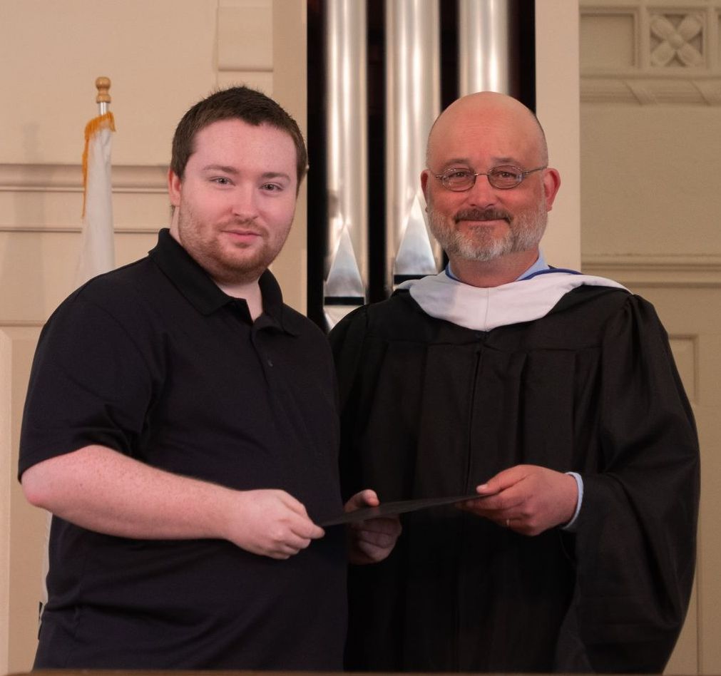 Cody Saylor being presented an award from Karl Wallhausser.