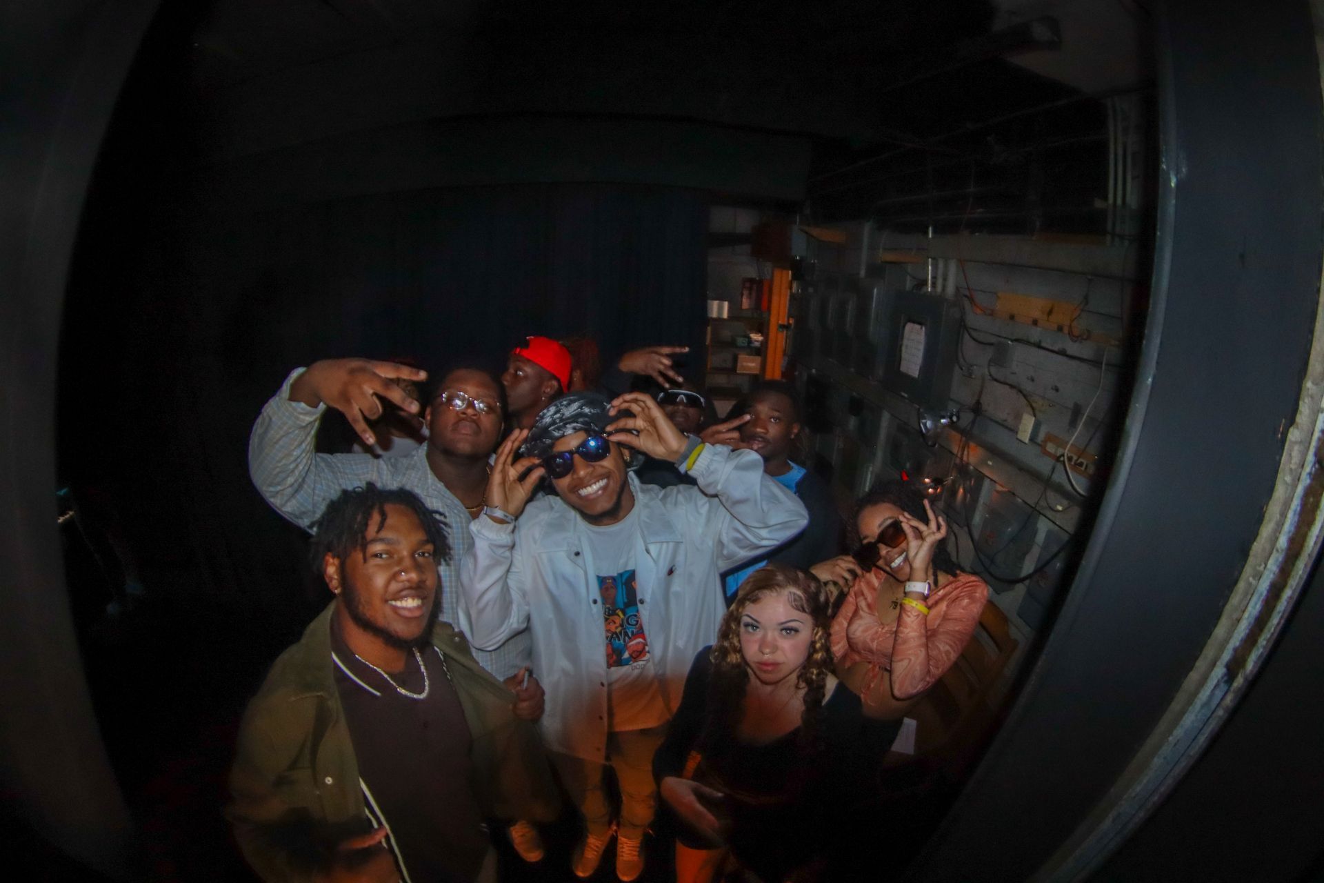 BSU members posing together behind stage.