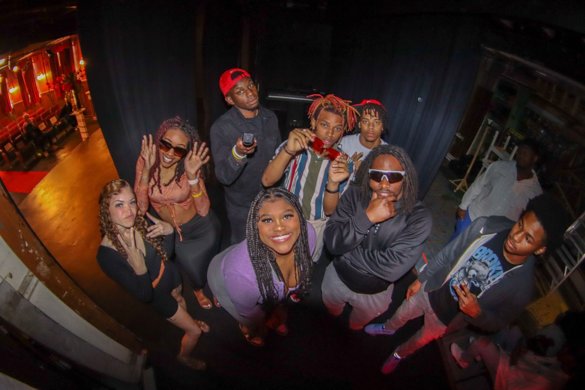 BSU members posing together behind stage.