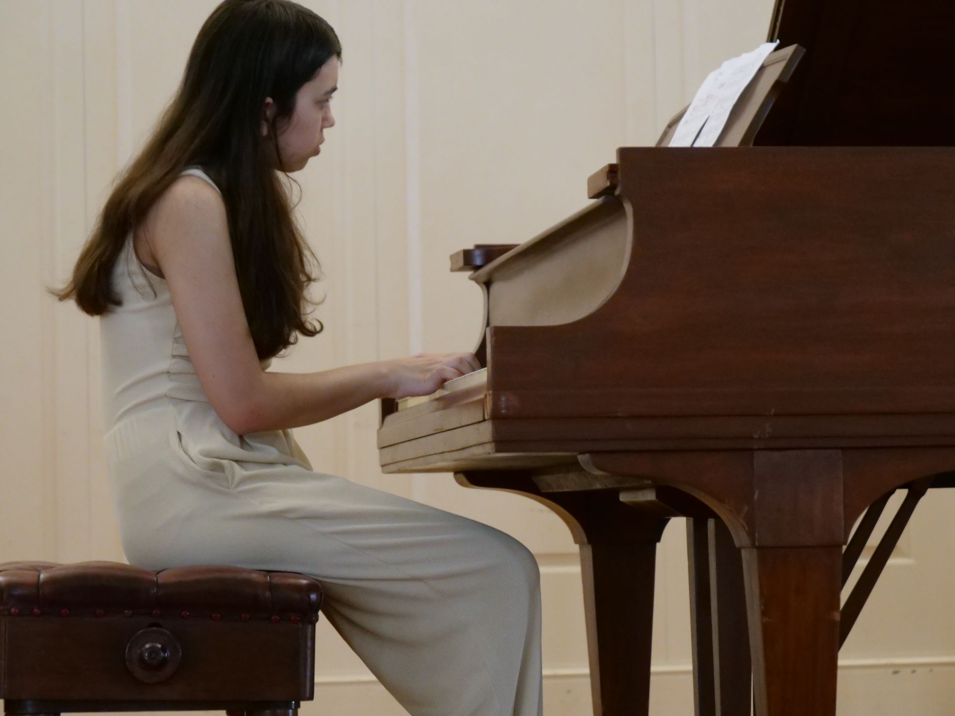 Local youth Vilia Travers Skidmore plays piano in Union's Conway Boatman Chapel