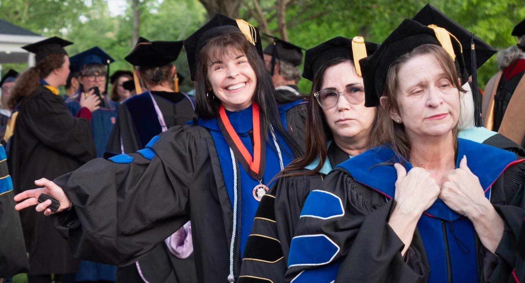 Dr. Christine Marley-Frederick leading a line of Union professors at commencement with Dr. Lori Henderson and Dr. Stella Rostkowski following behind.