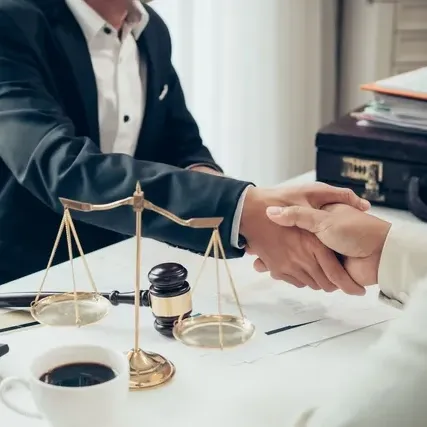 Attorney Handshakes A Person - West Des Moines, IA - Hopkins Law Office Attorney Handshakes A Person - West Des Moines, IA - Hopkins Law Office