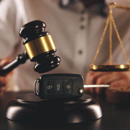 Close Up Of Judge Gavel And Car Keys Over Soundboard On White Background - West Des Moines, IA - Hopkins Law Office Close Up Of Judge Gavel And Car Keys Over Soundboard On White Background - West Des Moines, IA - Hopkins Law Office