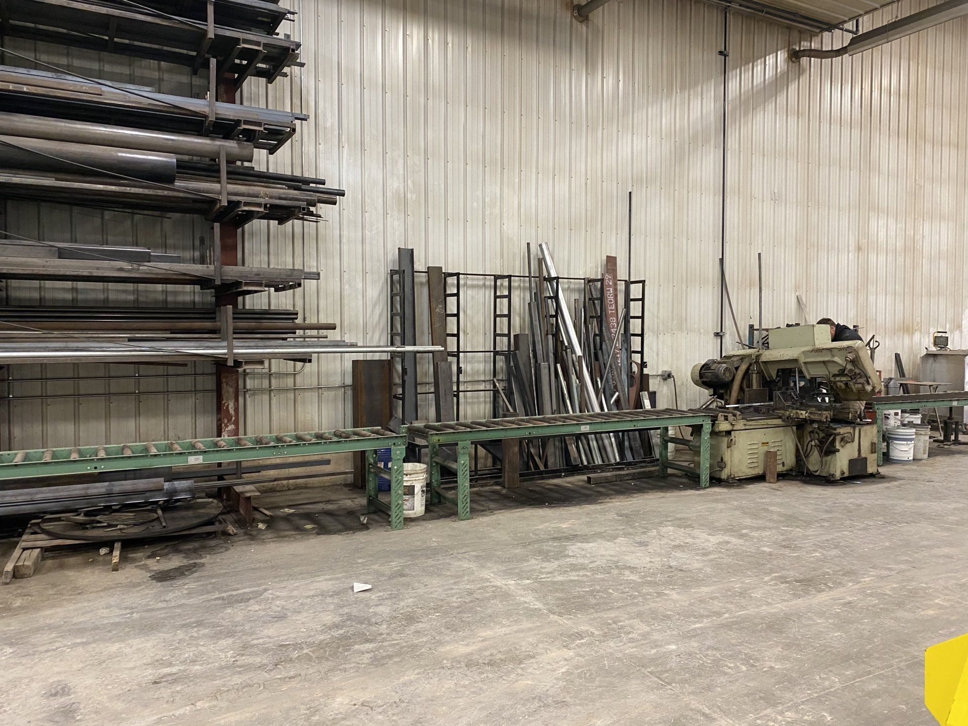 A warehouse filled with lots of metal pipes and machinery.