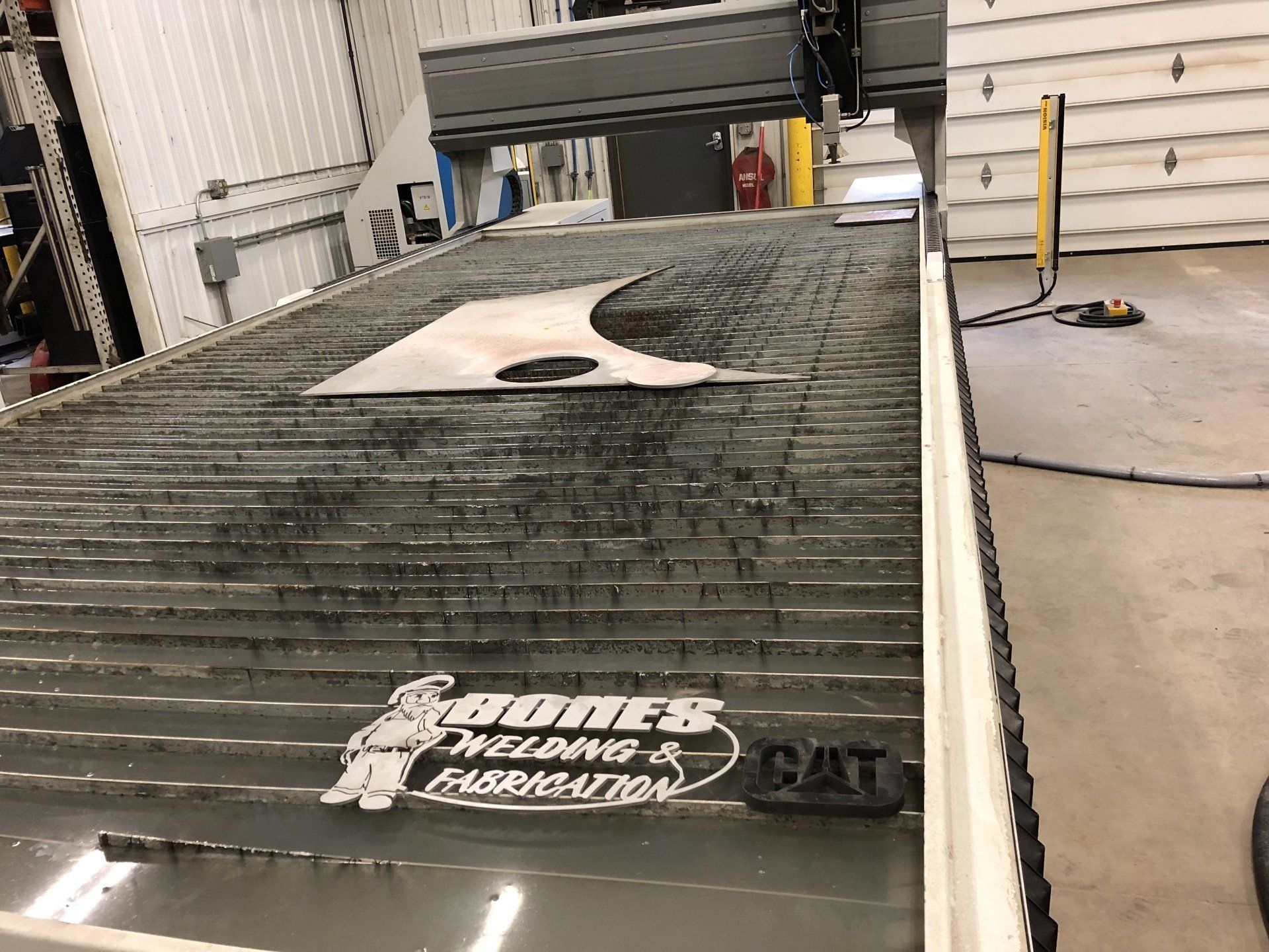 A machine that says bones welding and fabrication on it