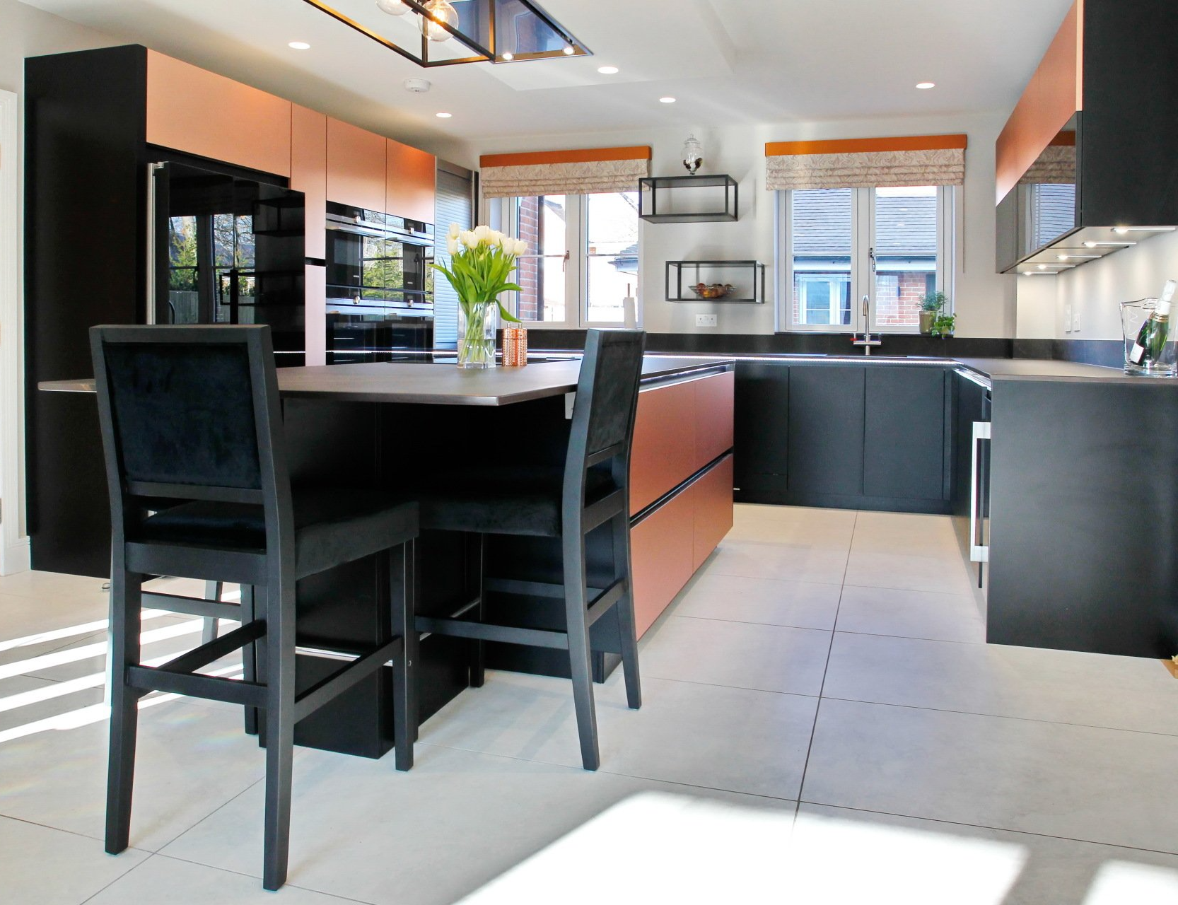 We used warm copper tones to bring light to the striking black units.