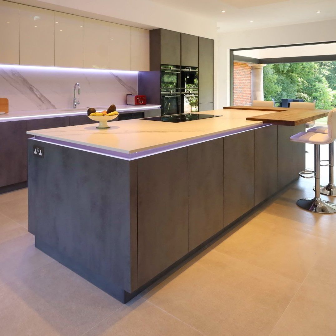 Harvey contemporary kitchen with grey, handleless units and teal furnishings. Designed by exact Kitchens in Wokingham.