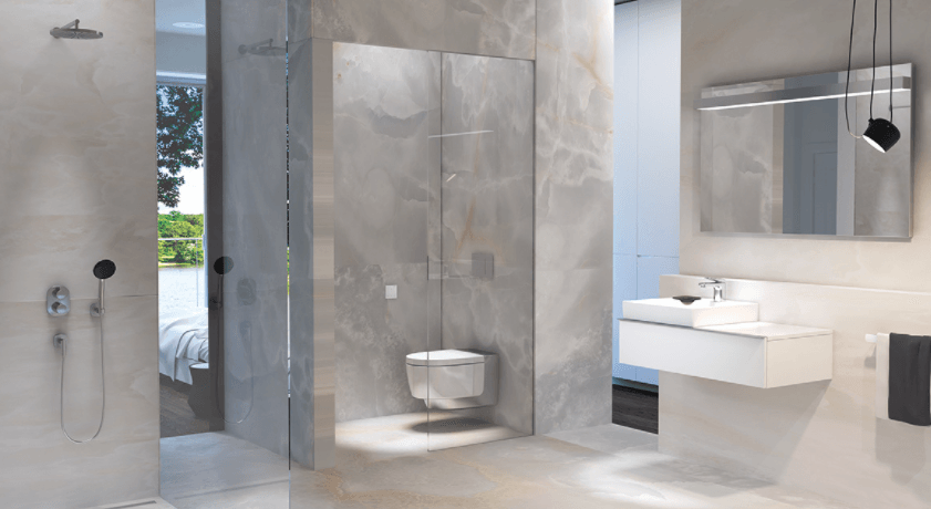 Modern bathroom with a walk-in shower, wall-mounted toilet, floating vanity, and large mirror.