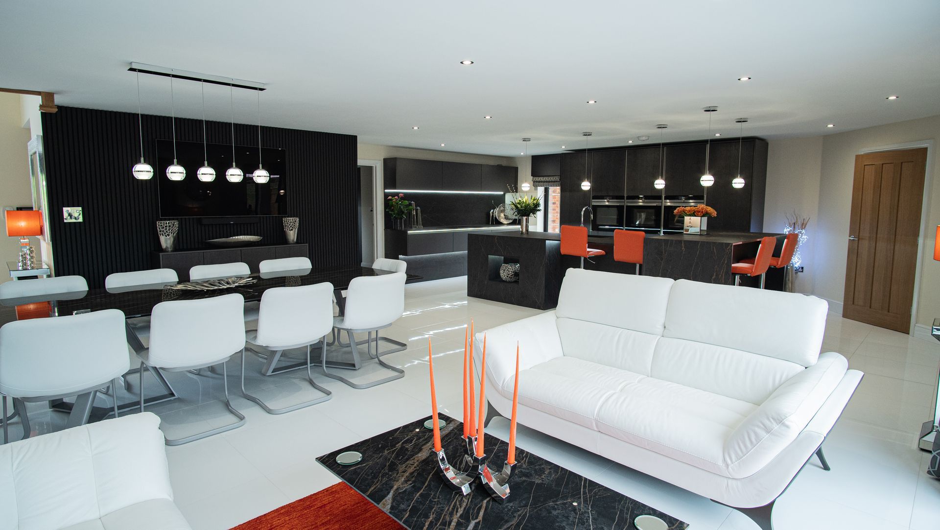 Harvey contemporary kitchen with grey, handleless units and teal furnishings. Designed by exact Kitchens in Wokingham.