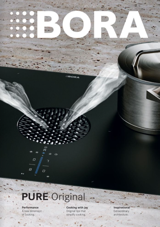 Bora cooktop with steam rising from a pot; black surface, stainless steel pot. Logo in upper left.