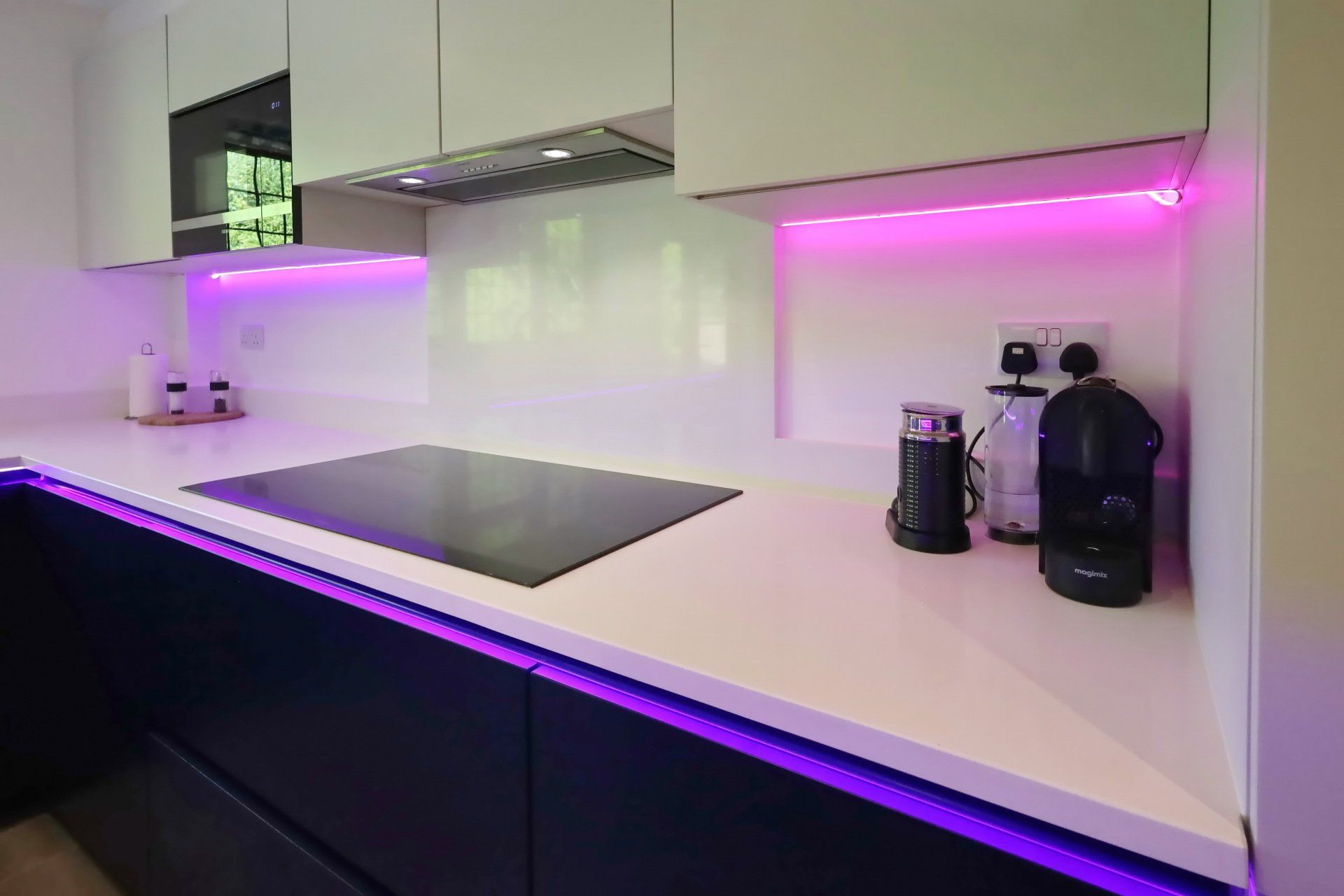 Harvey contemporary kitchen with grey, handleless units and teal furnishings. Designed by exact Kitchens in Wokingham.