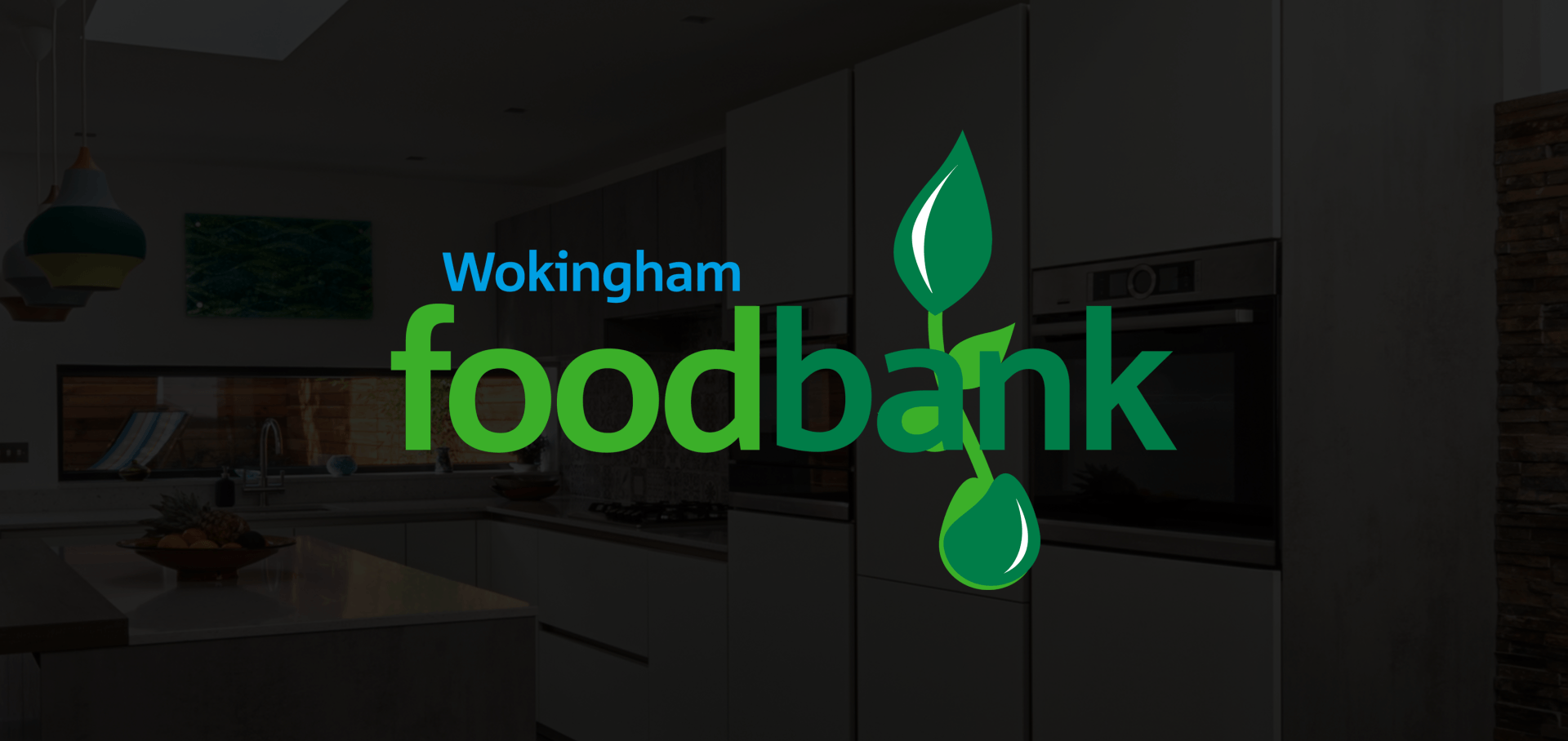 Wokingham foodbank logo with green plant in front of a modern kitchen.