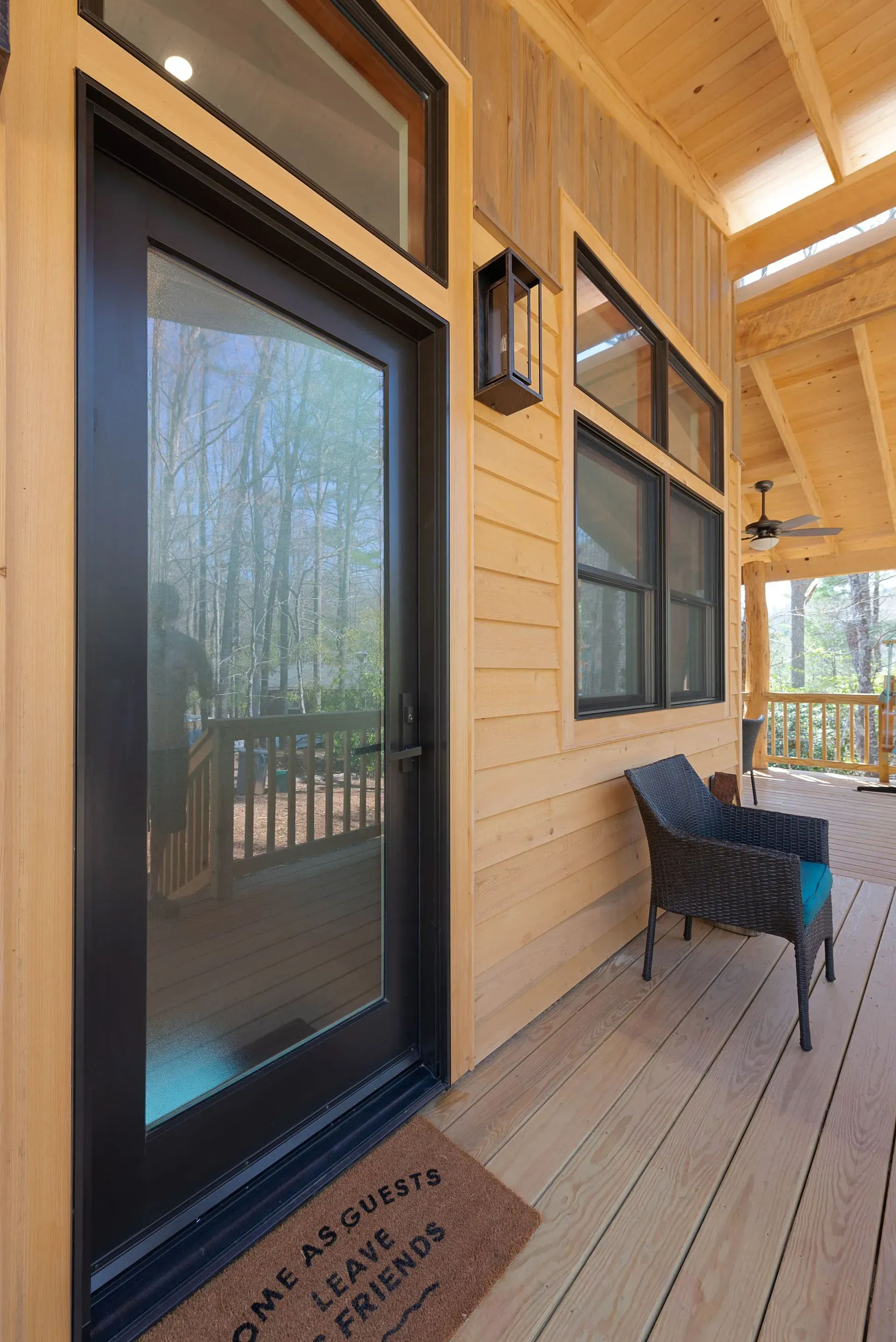 Newly completed Nanostead ADU in Swannanoa, NC, with wrap-around deck and rustic black locust porch posts