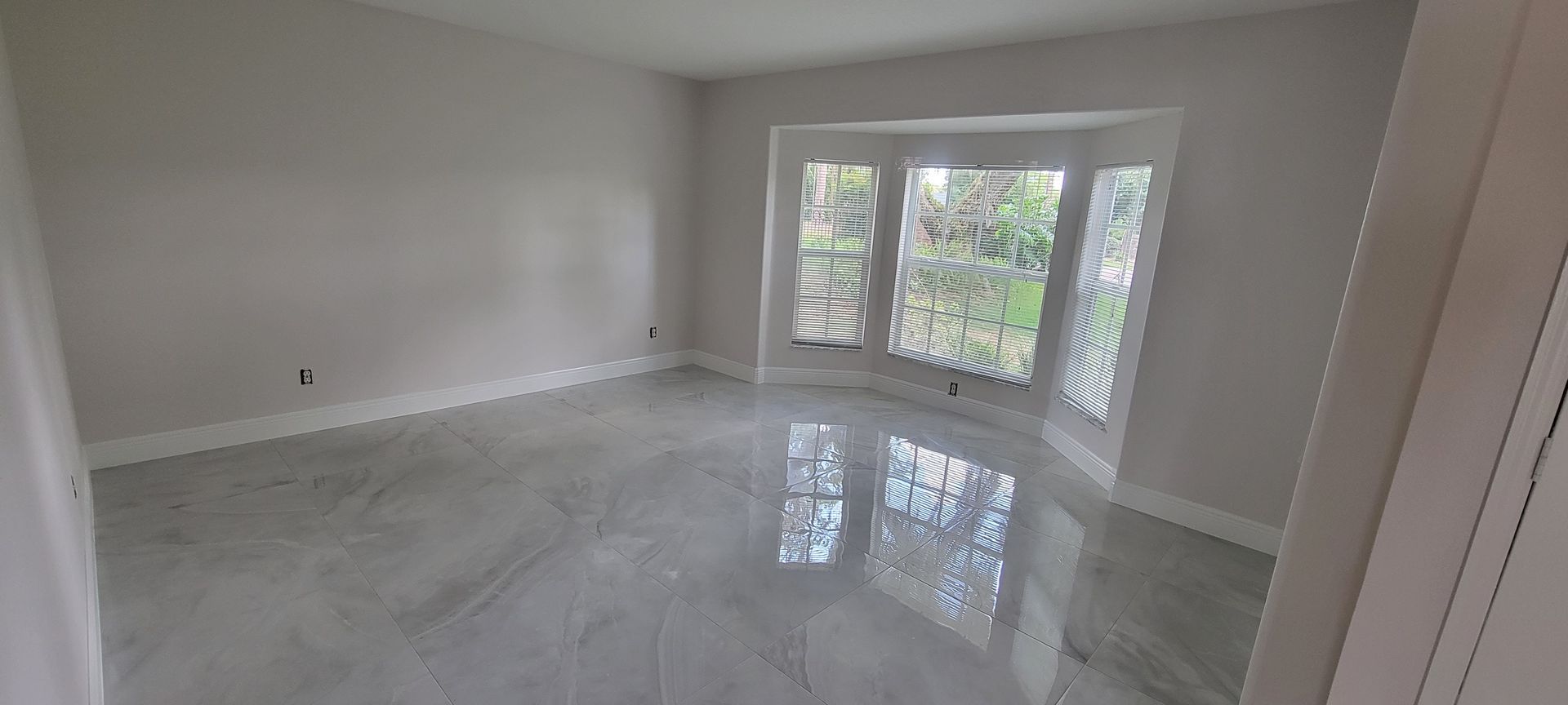 There is a large window in the middle of the room.