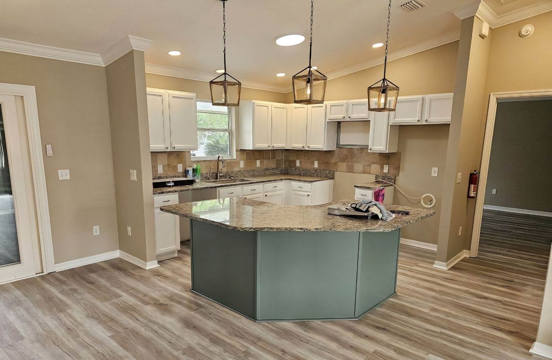 There is a large island in the middle of the kitchen.