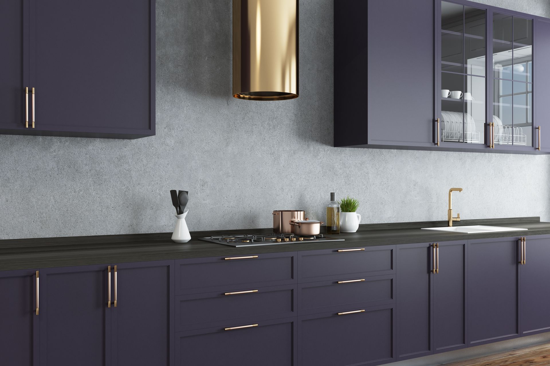 A kitchen with purple cabinets and a gold hood.