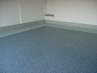 Empty carpeted room with light walls and a small window or vent near the corner