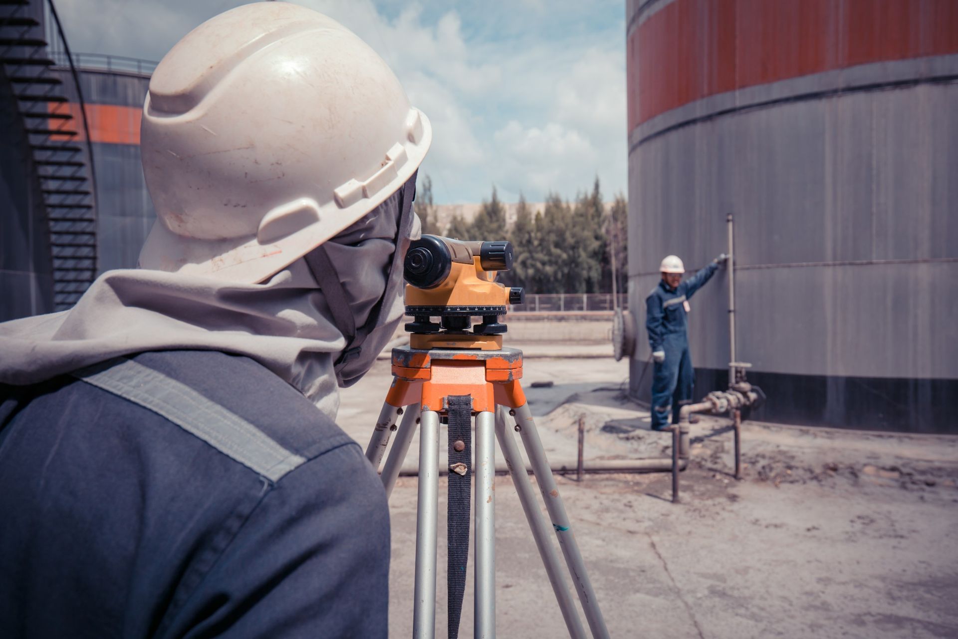 Male worker inspection survey level of storage tank