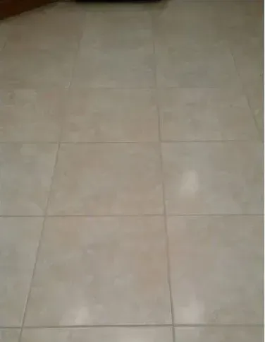 A close up of a tiled floor in a room.