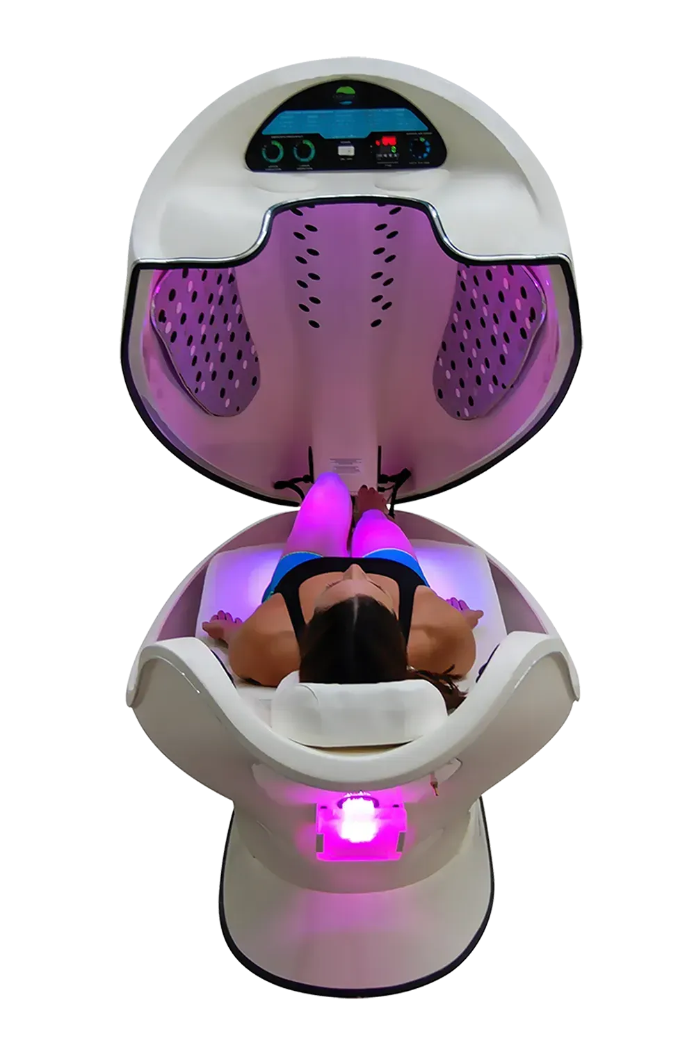 Person inside a white and pink spa pod with the lid open, light illuminating the interior.
