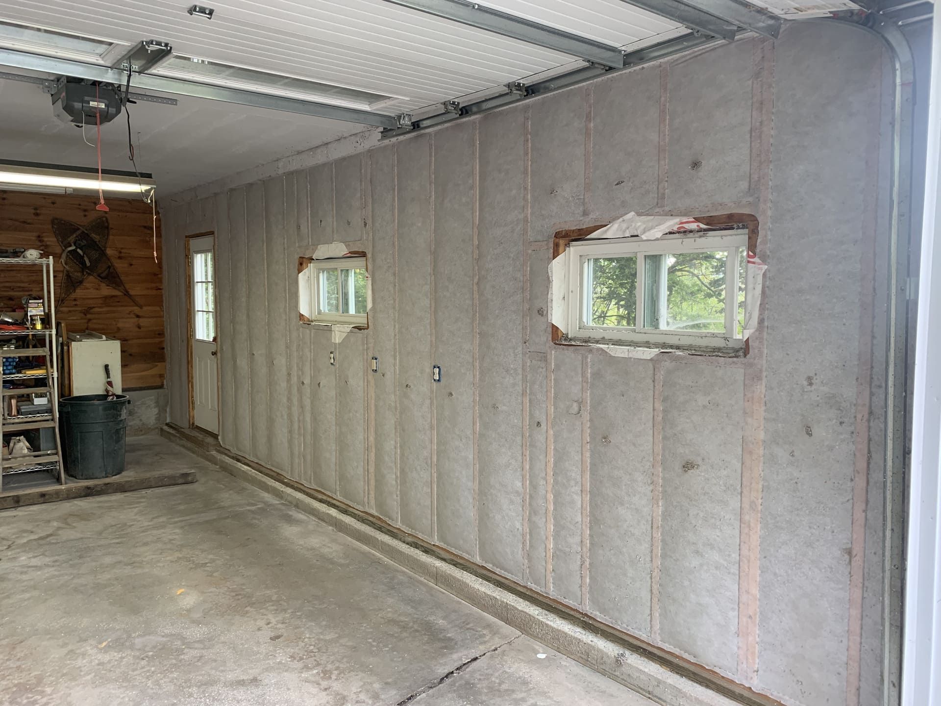 A house is being built with a vaulted ceiling and lots of windows.