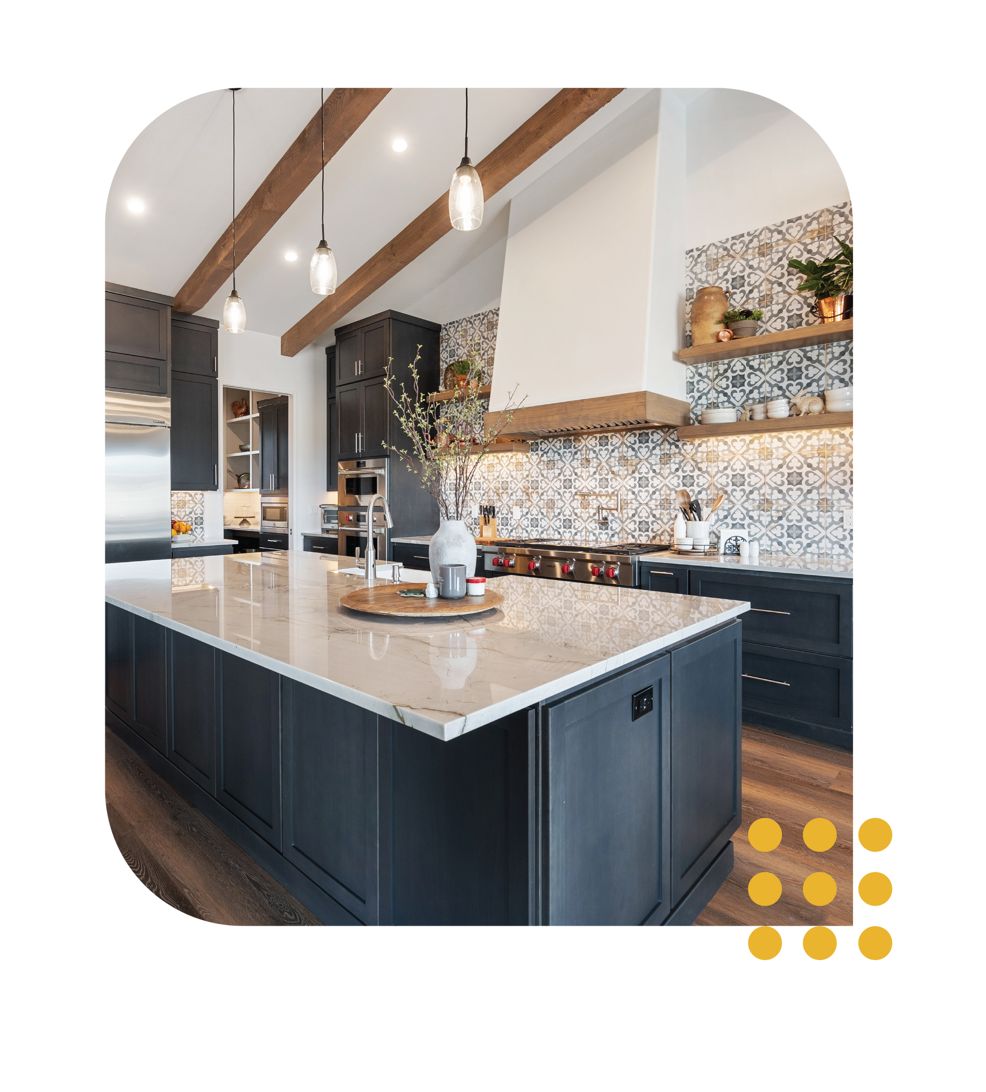 Modern kitchen with a large island, pendant lights, dark cabinets, and patterned backsplash