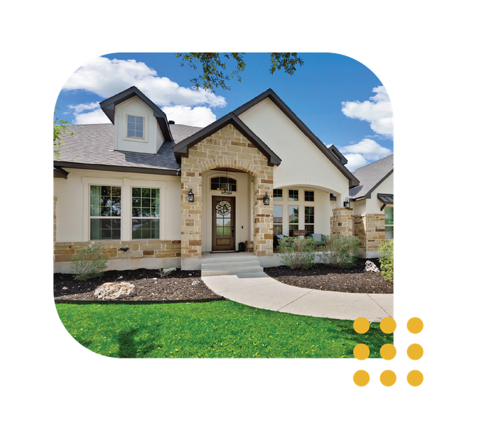 Modern single-story house with stone accents, arched entryway, and a curved walkway under a blue sky.
