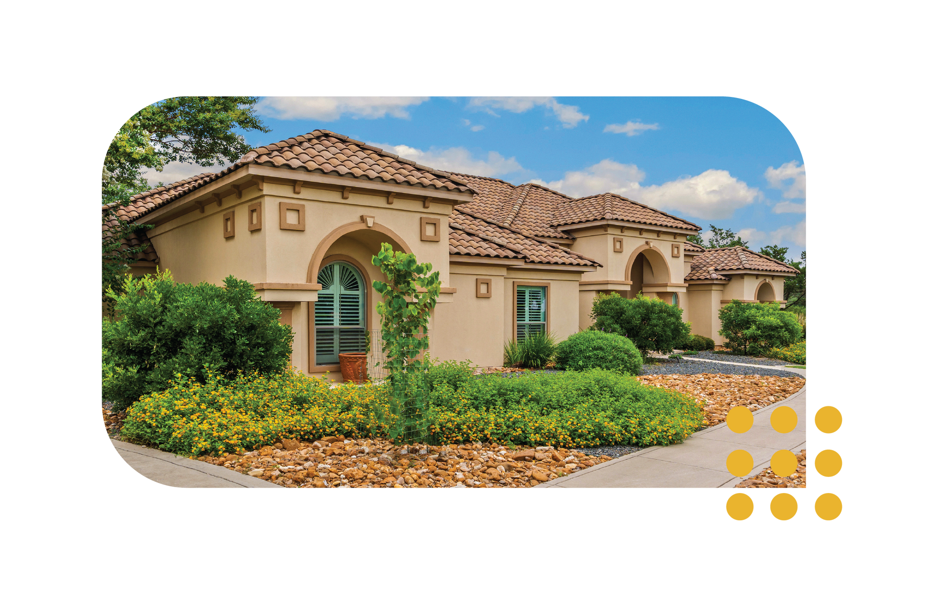Single-story beige stucco house with terracotta roof, arched windows, and lush front landscaping