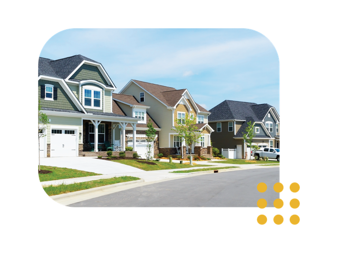 Row of modern suburban houses on a sunny residential street